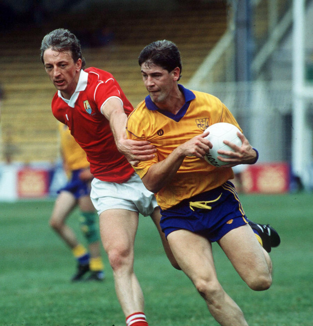 conor-counihan-of-cork-tackles-eamon-mcmanus-of-roscommon-1990