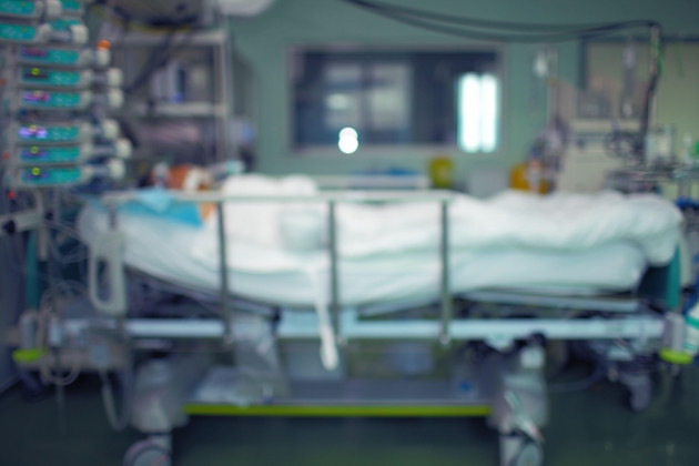 icu-with-patient-in-bed-unfocused-medical-background