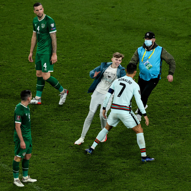 a-pitch-invader-runs-onto-the-field-in-an-attempt-to-meet-cristiano-ronaldo