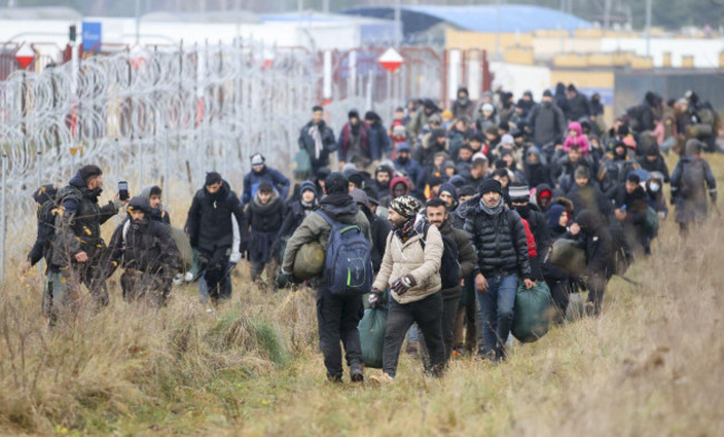 grodno-belarus-12th-nov-2021-grodno-region-belarus-november-12-2021-a-group-of-refugees-head-to-a-tent-camp-on-the-belarusian-polish-border-since-the-start-of-2021-migrants-have-been-headin