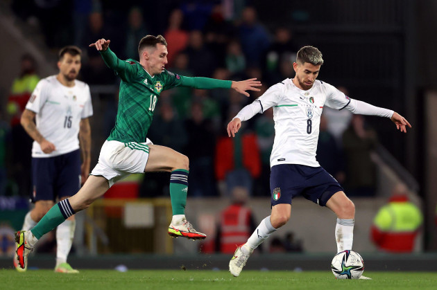 northern-irelands-gavin-whyte-left-and-italys-jorginho-battle-for-the-ball-during-the-fifa-world-cup-qualifying-match-at-windsor-park-belfast-picture-date-monday-november-15-2021