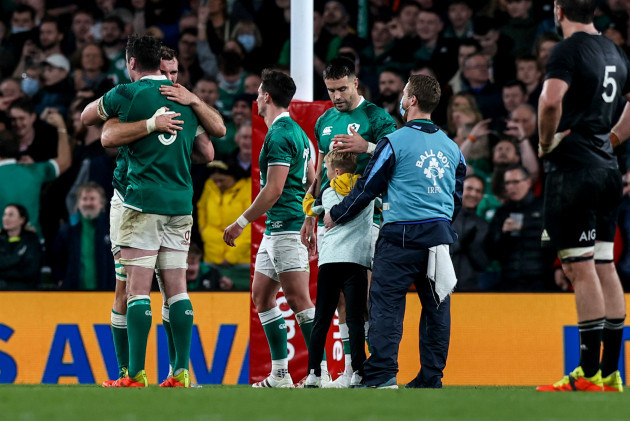 a-pitch-invader-runs-onto-the-field-after-the-final-whistle-and-reaches-conor-murray-to-ask-him-for-his-boots