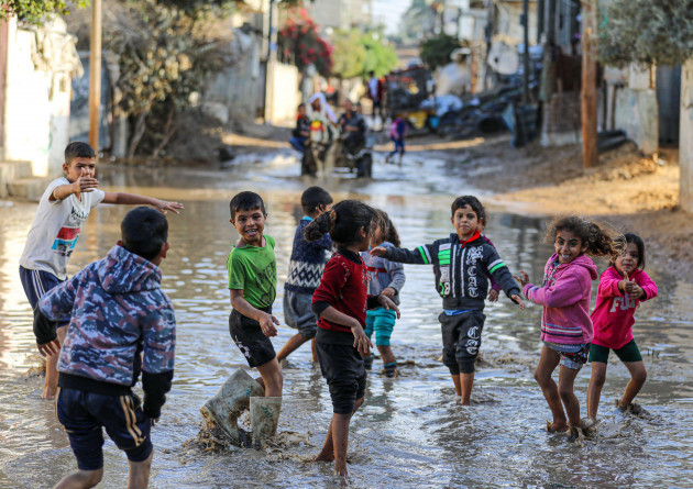 gaza-city-palestine-19th-november-2021-palestinian-children-play-on-a-street-flooded-with-water-due-to-heavy-rains-in-a-poor-neighborhood-east-of-gaza-city-credit-majority-world-cicalamy-live-ne