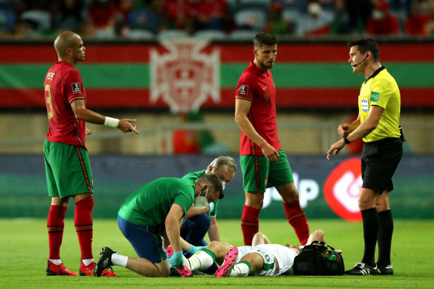 republic-of-irelands-dara-oshea-receives-medical-attention-during-the-2022-fifa-world-cup-qualifying-match-at-the-estadio-algarve-portugal-picture-date-wednesday-september-1-2021