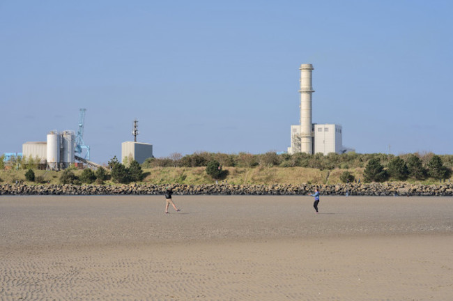 beautiful-closeup-bright-view-of-esb-dublin-bay-power-station-and-ringsend-station-against-clear-blue-sky-seen-from-sandymount-beach-dublin-ireland