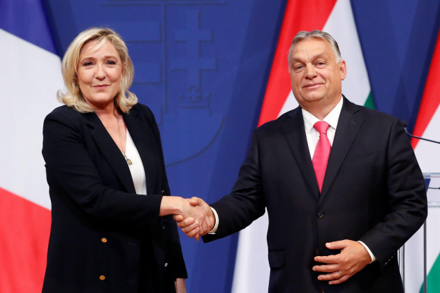 french-far-right-leader-marine-le-pen-and-hungarian-prime-minister-viktor-orban-shake-hands-after-holding-a-joint-news-conference-in-budapest-hungary-october-26-2021-reutersbernadett-szabo