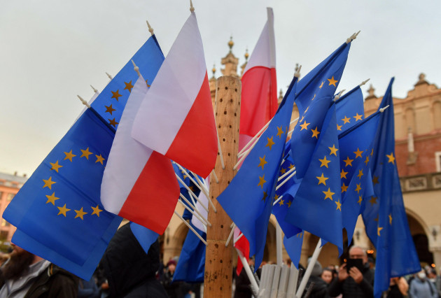 krakow-poland-07th-nov-2021-flags-of-the-european-union-and-poland-are-seen-pinned-up-during-the-protest-thousands-take-to-the-streets-of-poland-in-protest-after-the-death-of-30-year-old-izabela