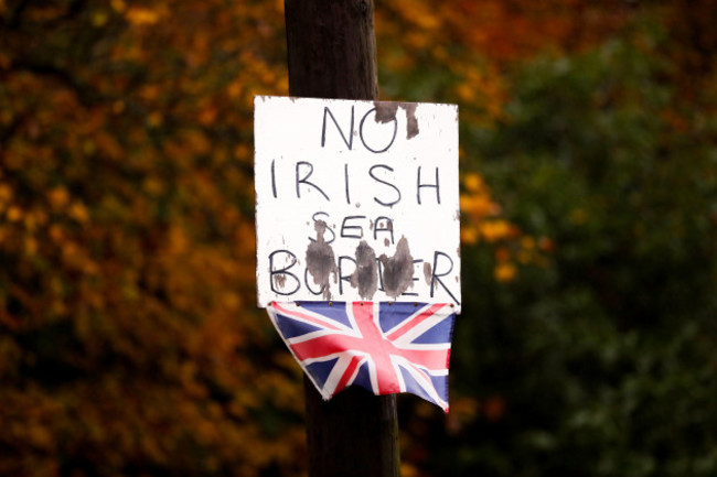 anti-irish-sea-border-placard-and-small-union-flag-attached-to-a-lamppost-in-bangor-northern-ireland-in-opposition-to-the-northern-ireland-protocol