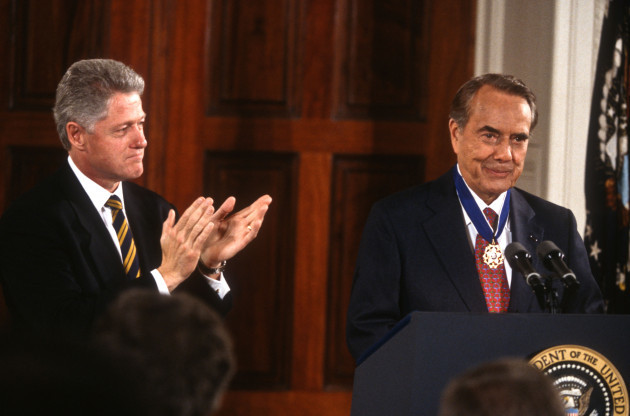 president-bill-clinton-applauds-senator-bob-dole-after-awarding-him-the-medal-of-freedom-at-the-white-house