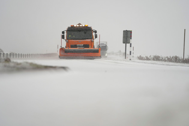 a-snowplough-makes-its-way-through-falling-snow-on-the-a66-between-stainmore-and-bowes-as-storm-barra-hit-the-uk-and-ireland-with-disruptive-winds-heavy-rain-and-snow-on-tuesday-picture-date-tuesda