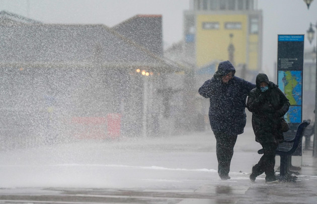 people-brave-the-weather-as-they-make-their-way-along-the-sea-front-in-southsea-as-storm-barra-hit-the-uk-and-ireland-with-disruptive-winds-heavy-rain-and-snow-on-tuesday-picture-date-tuesday-decem