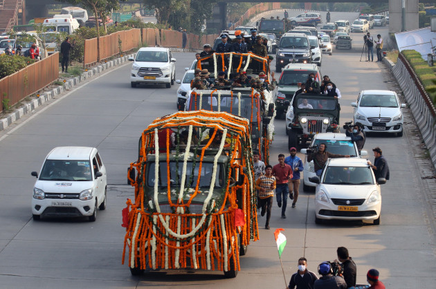 new-delhi-india-10th-dec-2021-an-army-vehicle-covered-with-flowers-carrying-the-coffin-of-the-chief-of-defense-staff-cds-general-bipin-rawat-transported-to-a-funeral-site-during-the-funeral-proc