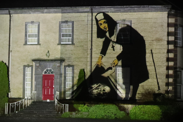 an-image-of-a-nun-concealing-a-skeleton-is-projected-onto-sean-ross-abbey-south-of-roscrea-in-county-tipperary-ireland-on-st-brigidos-day-for-the-herstory-light-show-when-landmarks-across-ireland