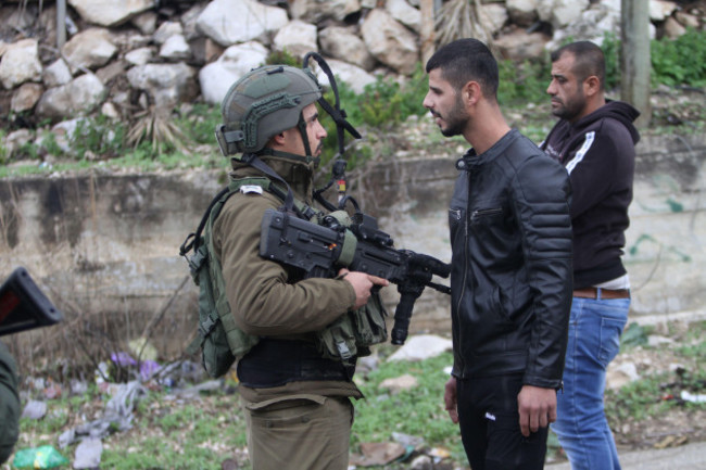 nablus-west-bank-palestine-17th-dec-2021-israeli-soldiers-push-palestinians-during-a-demonstration-by-jewish-settlers-after-the-killing-of-an-israeli-settler-from-the-jewish-settlement-of-shavei