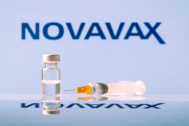 novavax-coronavirus-vaccine-vial-and-syringe-with-logo-as-background-ljubljana-slovenia-march-25-2021