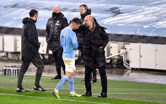 manchester-city-manager-pep-guardiola-embraces-ferran-torres-after-he-is-substituted-during-the-premier-league-match-at-the-etihad-stadium-manchester
