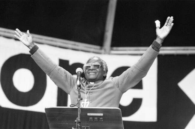 archbishop-desmond-tutu-holds-a-religious-gathering-at-villa-park-football-stadium-birmingham-sunday-23rd-april-1989-standing-at-podium