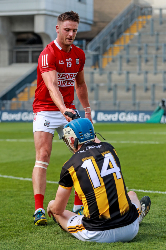 eoin-cadogan-helps-tj-reid-up-after-the-game