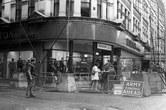 shoppers-are-seen-in-the-centre-of-belfast-today-where-they-are-being-checked-and-searched-by-troops-a-warning-notice-tells-pedestrians-that-army-control-is-operating-in-the-heart-of-the-citys-shop