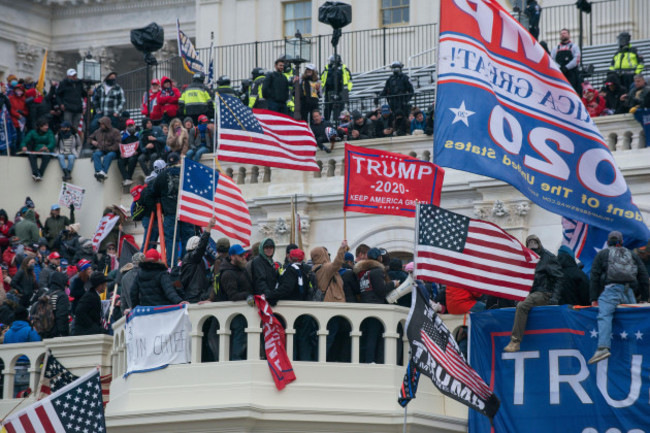 january-6th-2021-large-crowds-of-protesters-at-capitol-hill-with-donald-trump-2020-flags-us-capitol-building-washington-dc-usa
