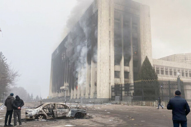 almaty-kazakhstan-6th-jan-2022-a-burnt-car-is-seen-outside-the-mayors-office-protests-were-sparked-by-rising-fuel-prices-in-the-towns-of-zhanaozen-and-aktau-in-western-kazakhstan-on-2-january-an