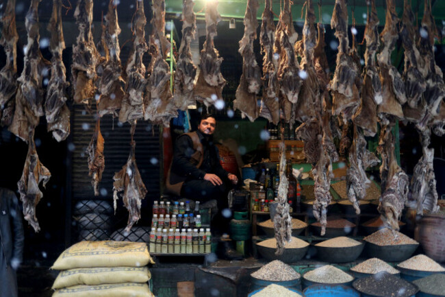 a-shopkeeper-waits-for-customers-during-a-snowfall-in-kabul-afghanistan-january-3-2022-reutersali-khara