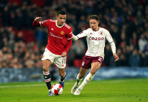 manchester-uniteds-mason-greenwood-left-and-aston-villas-matty-cash-battle-for-the-ball-during-the-emirates-fa-cup-third-round-match-at-old-trafford-manchester-picture-date-monday-january-10-2