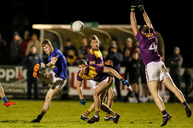 kevin-quinn-kicks-past-gavin-sheehan-and-robbie-barron