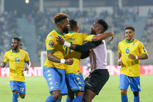 yaounde-cameroon-january-18-jim-allevinah-of-gabon-celebrates-with-aaron-boupendza-and-donald-nze-after-scoring-goal-during-the-2021-africa-cup-of-nations-group-c-match-between-gabon-and-morocco-a