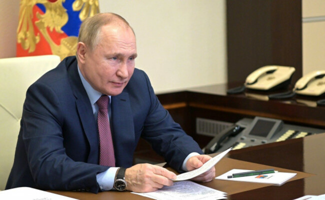 january-26-2022-russia-moscow-region-novo-ogaryovo-russian-president-vladimir-putin-iat-the-novo-ogaryovo-residence-during-a-video-conference-meeting-with-italian-business-leaders