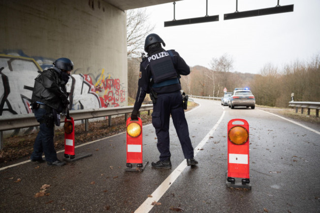mayweilerhof-germany-31st-jan-2022-police-officers-stand-at-a-barricade-on-county-road-22-about-a-kilometer-from-the-scene-where-two-police-officers-were-killed-by-gunfire-credit-sebastian-golln