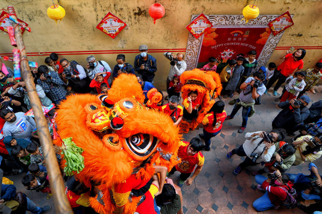 kolkata-india-01st-feb-2022-people-dressed-in-dragon-costumes-perform-during-the-lunar-new-year-celebration-lunar-new-year-falls-on-february-1-to-welcome-the-year-of-tiger-and-its-celebrated-by-t