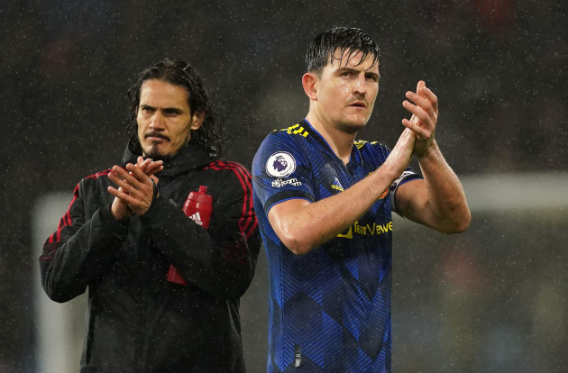manchester-uniteds-harry-maguire-right-and-edinson-cavani-appear-dejected-after-the-premier-league-match-at-turf-moor-burnley-picture-date-tuesday-february-8-2022