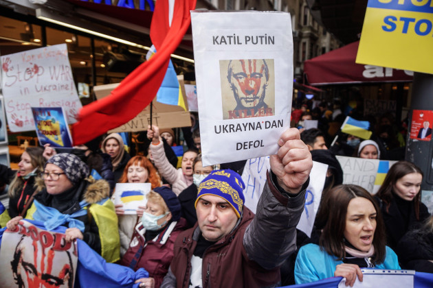 istanbul-turkey-25th-feb-2022-a-protester-holds-a-placard-with-a-portrait-of-vladimir-putin-during-the-demonstration-ukrainian-citizens-living-in-istanbul-gathered-in-front-of-the-russian-consulat
