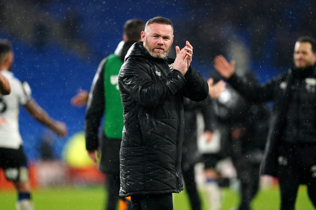 derby-county-manager-wayne-rooney-applauds-the-fans-after-the-final-whistle-in-the-sky-bet-championship-match-at-the-cardiff-city-stadium-cardiff-picture-date-tuesday-march-1-2022