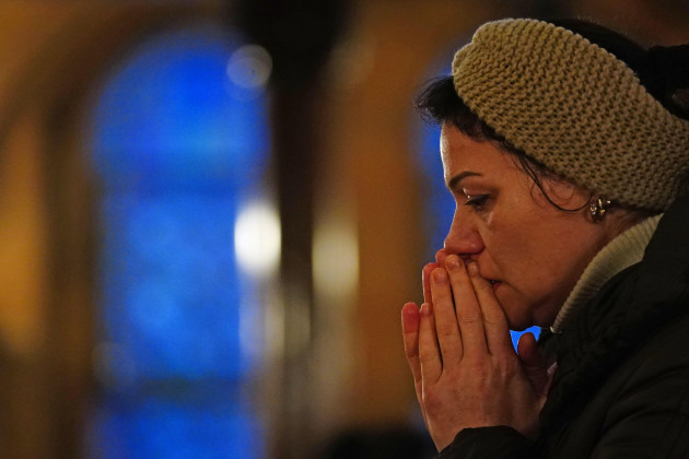 a-person-praying-at-the-ukrainian-catholic-cathedral-of-the-holy-family-in-london-following-russias-invasion-of-ukriane-following-russias-invasion-of-ukriane-picture-date-wednesday-march-2-2022