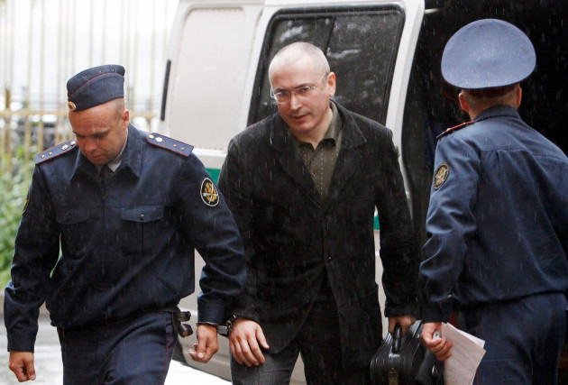 jailed-former-russian-oil-tycoon-mikhail-khodorkovsky-c-arrives-at-a-court-for-his-trial-on-money-laundering-and-embezzlement-charges-in-moscow-may-26-2010-the-kremlin-ordered-the-arrest-of-russia