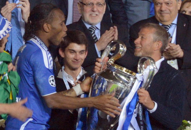 19-05-2012-munich-germany-chelseas-owner-roman-abramovich-r-and-didier-drogba-l-lift-the-trophy-after-winning-the-uefa-champions-league-soccer-final-between-fc-bayern-munich-and-fc-chelsea-at