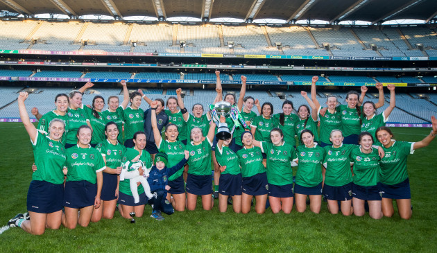 the-sarsfields-team-celebrate-with-the-trophy-after-the-game