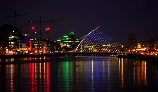 the-samuel-beckett-bridge-in-dublins-city-centre-displays-the-colours-of-the-ukrainian-flag-as-a-show-of-support-more-than-2500-ukrainian-refugees-have-already-arrived-in-ireland-with-children-com