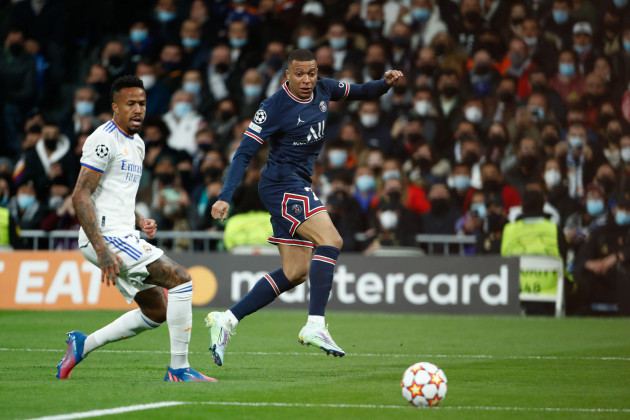 kylian-mbappe-of-psg-and-eder-militao-of-real-madrid-during-the-uefa-champions-league-round-of-16-2nd-leg-football-match-between-real-madrid-and-paris-saint-germain-on-march-9-2022-at-santiago-bern