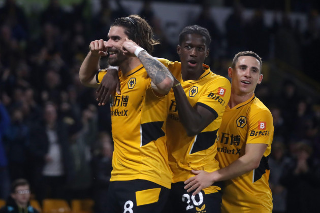 wolverhampton-wanderers-ruben-neves-left-celebrates-with-chiquinho-centre-and-daniel-podence-after-scoring-their-sides-fourth-goal-of-the-game-during-the-premier-league-match-at-molineux-stadium
