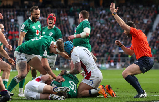 garry-ringrose-josh-van-der-flier-and-jamison-gibson-park-celebrate-as-hugo-keenan-scores-a-try