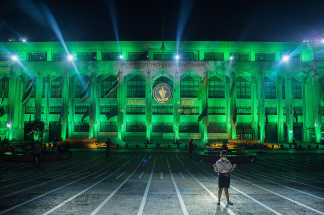 bangkok-thailand-17th-mar-2022-a-kid-seen-standing-in-front-of-the-bangkok-city-hall-building-decorated-with-green-light-to-celebrate-st-patricks-day-also-known-as-the-republic-of-ireland-nation