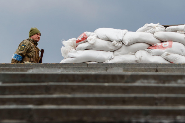 kyiv-kyiv-ukraine-24th-mar-2022-a-ukrainian-soldier-stands-guard-with-a-gun-at-a-military-checkpoint-picture-taken-with-permission-from-the-personnel-amid-russian-invasion-russian-offensive-a