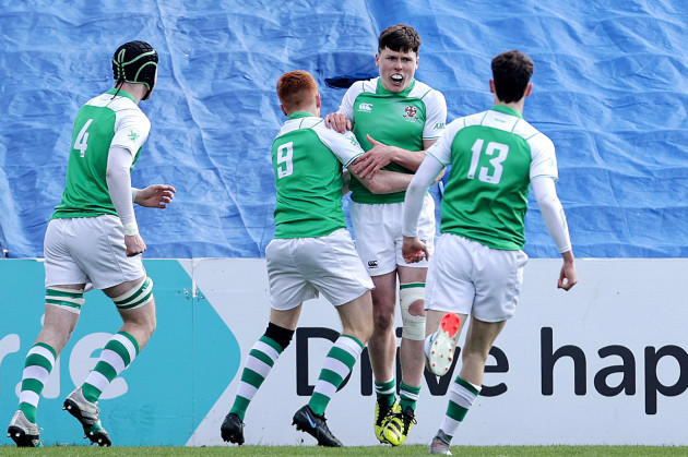 rory-finlay-celebrates-scoring-a-try-with-teammates