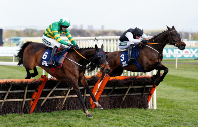 sire-du-berlais-ridden-by-mark-walsh-left-on-their-way-to-winning-the-jrl-group-liverpool-hurdle-during-grand-national-day-of-the-randox-health-grand-national-festival-2022-at-aintree-racecourse-li