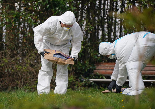 gardai-forensic-officers-put-a-pair-of-jeans-into-an-evidence-bag-in-a-field-near-the-scene-in-connaughton-road-sligo-ireland-following-the-death-of-michael-snee-picture-date-wednesday-april-13
