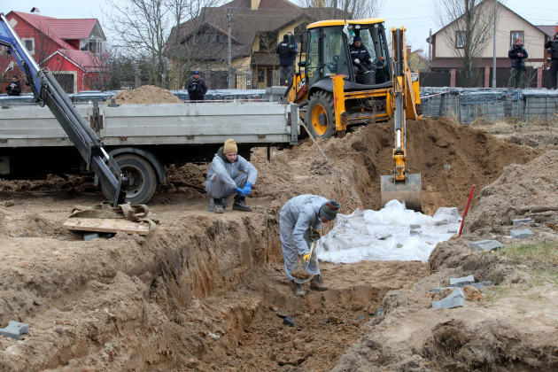 bucha-kyiv-region-north-eastern-ukraine-on-april-13-2022-exhumation-of-bodies-from-another-mass-grave-where-civilians-killed-by-russian-occupants-are-buried-is-carried-out-in-bucha-kyiv-region