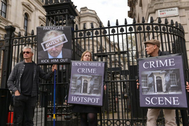 london-uk-13th-apr-2022-protesters-hold-placards-expressing-their-opinion-during-the-demonstration-anti-boris-johnson-protesters-staged-a-demonstration-opposite-downing-street-calling-boris-johns